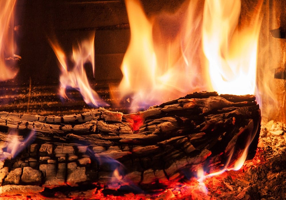 burning wood for fireplace